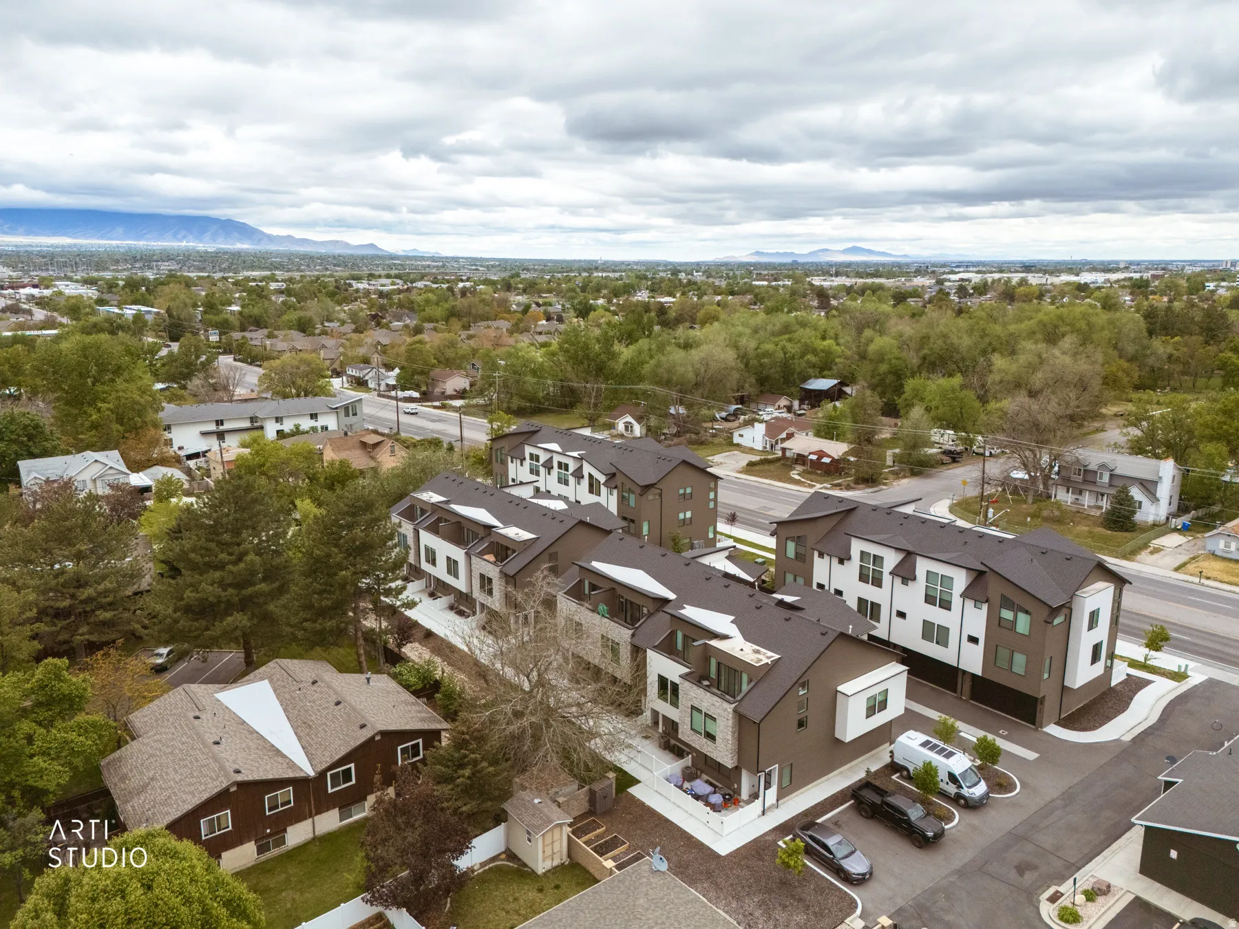 Aerial view of residential area featuring mountains