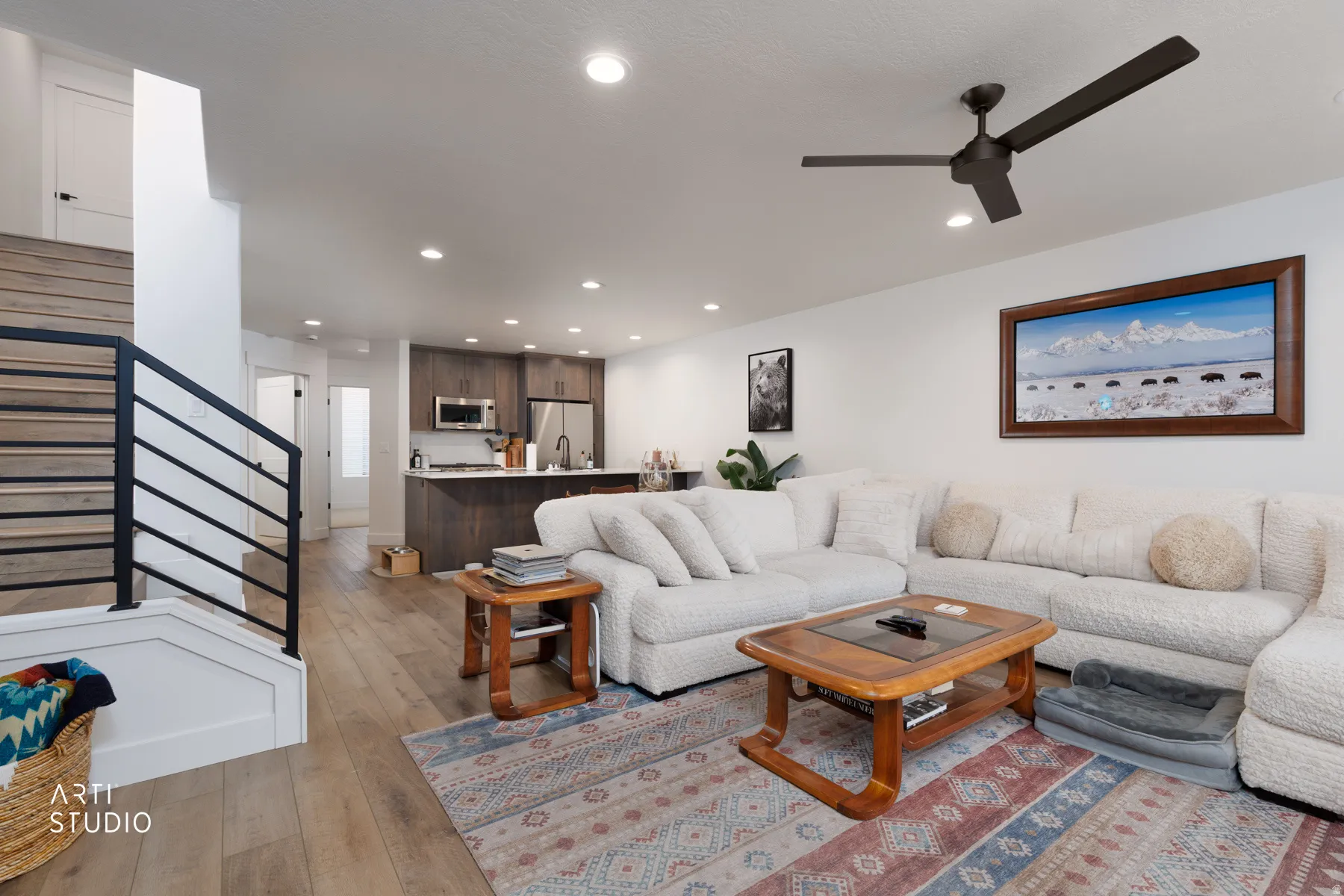 Living area with light wood-type flooring, recessed lighting, and ceiling fan