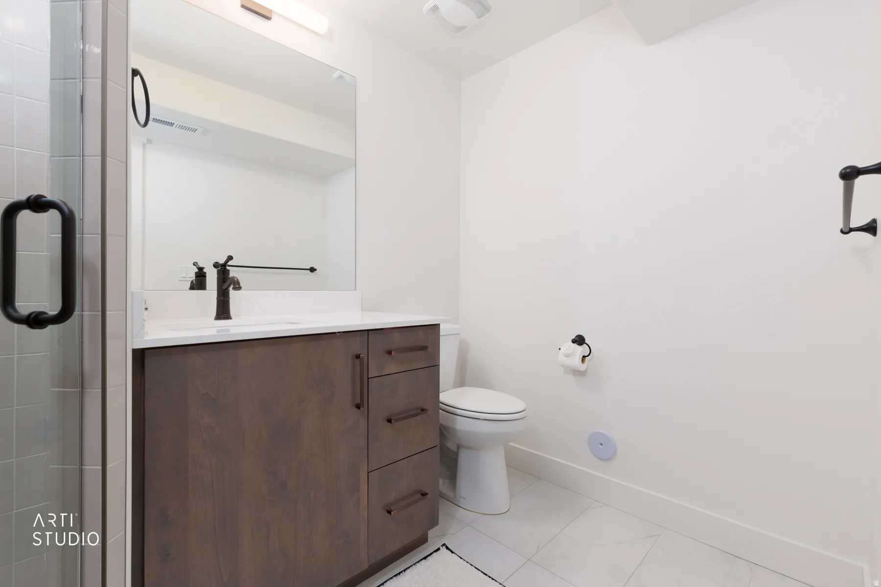 Bathroom with vanity and a stall shower