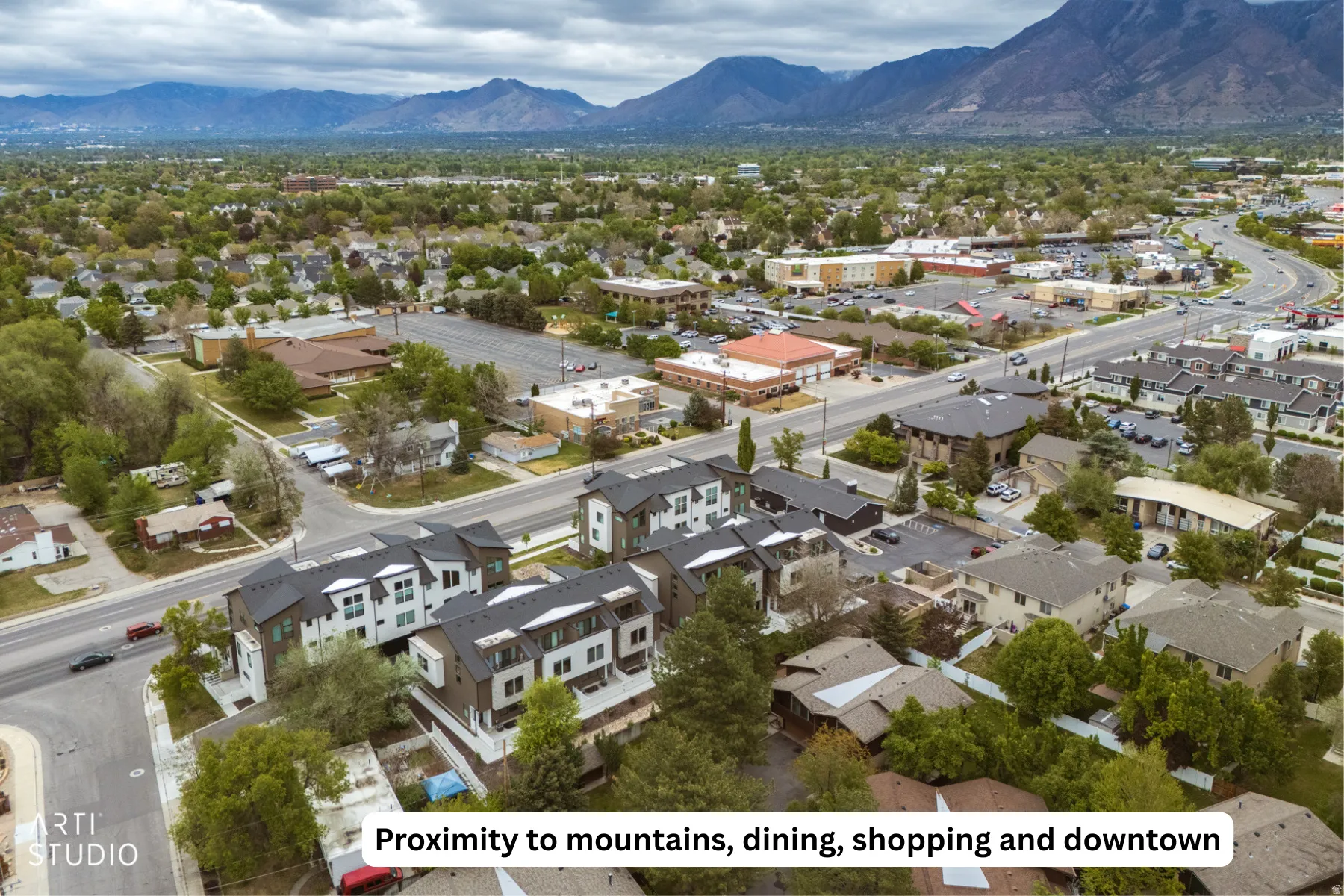 Aerial view of residential area featuring a mountainous background