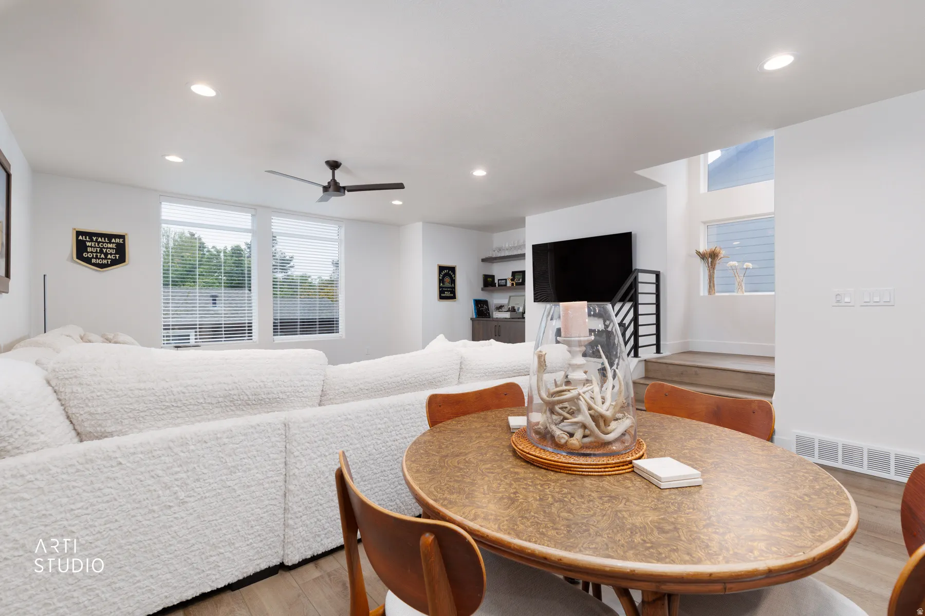 Dining room with light wood-style floors, recessed lighting, and ceiling fan