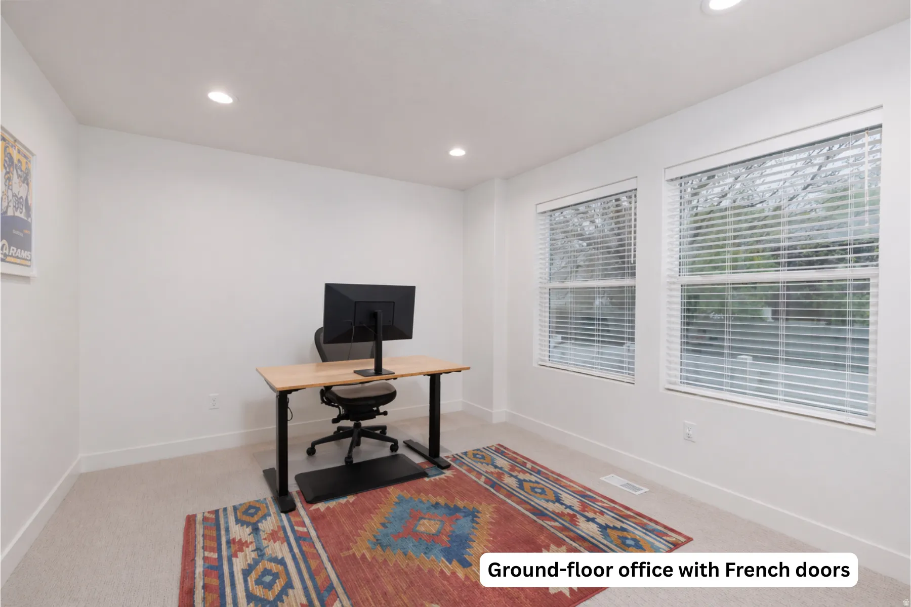 Office space with recessed lighting and light carpet