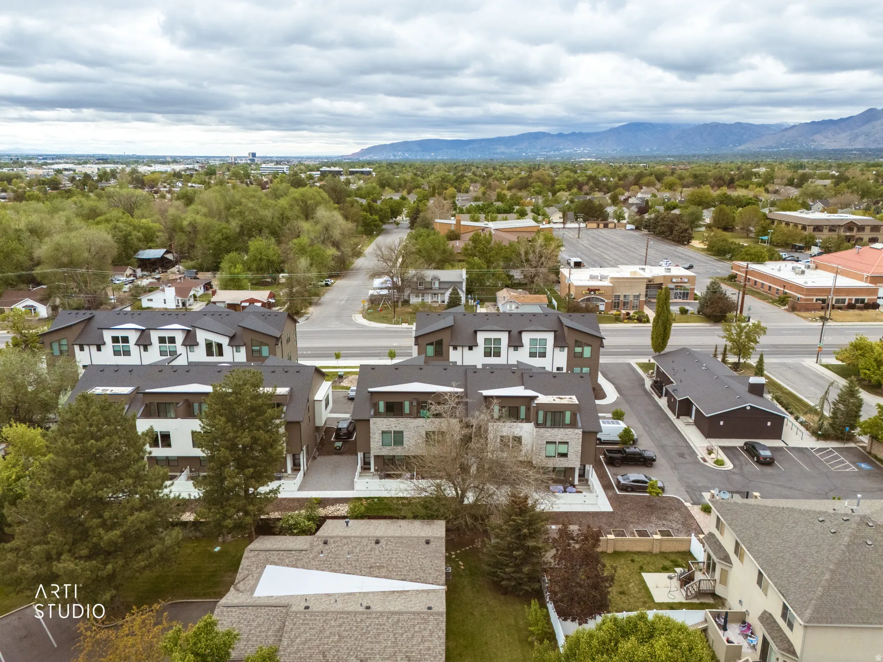 Aerial view of residential area featuring a mountain backdrop