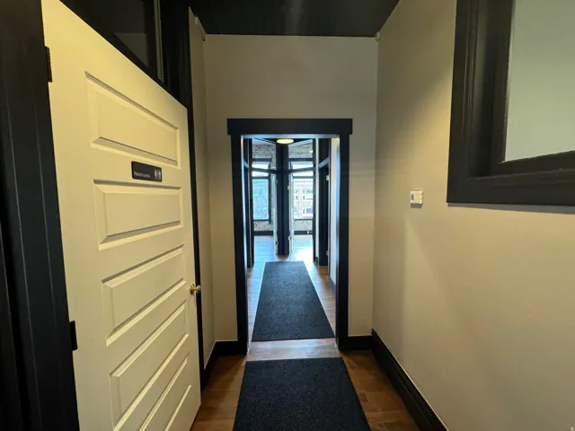 Corridor with baseboards and dark wood finished floors