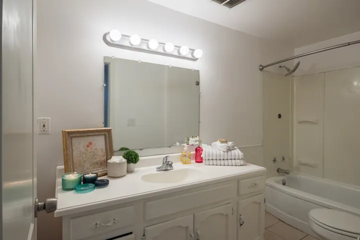 Full bathroom featuring vanity,  shower combination, and light tile patterned floors