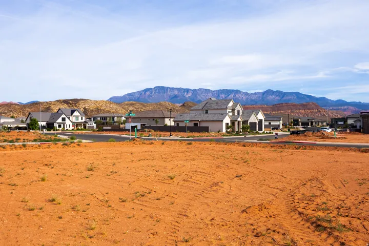 View of mountain backdrop featuring nearby suburban area