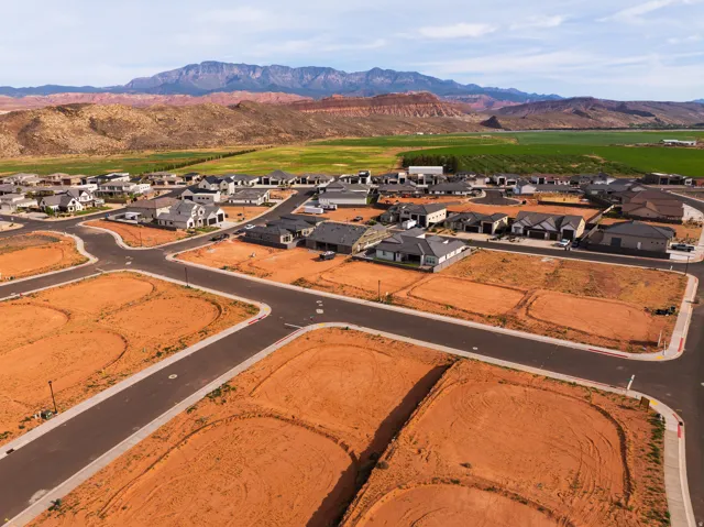 Aerial view of residential area featuring mountains
