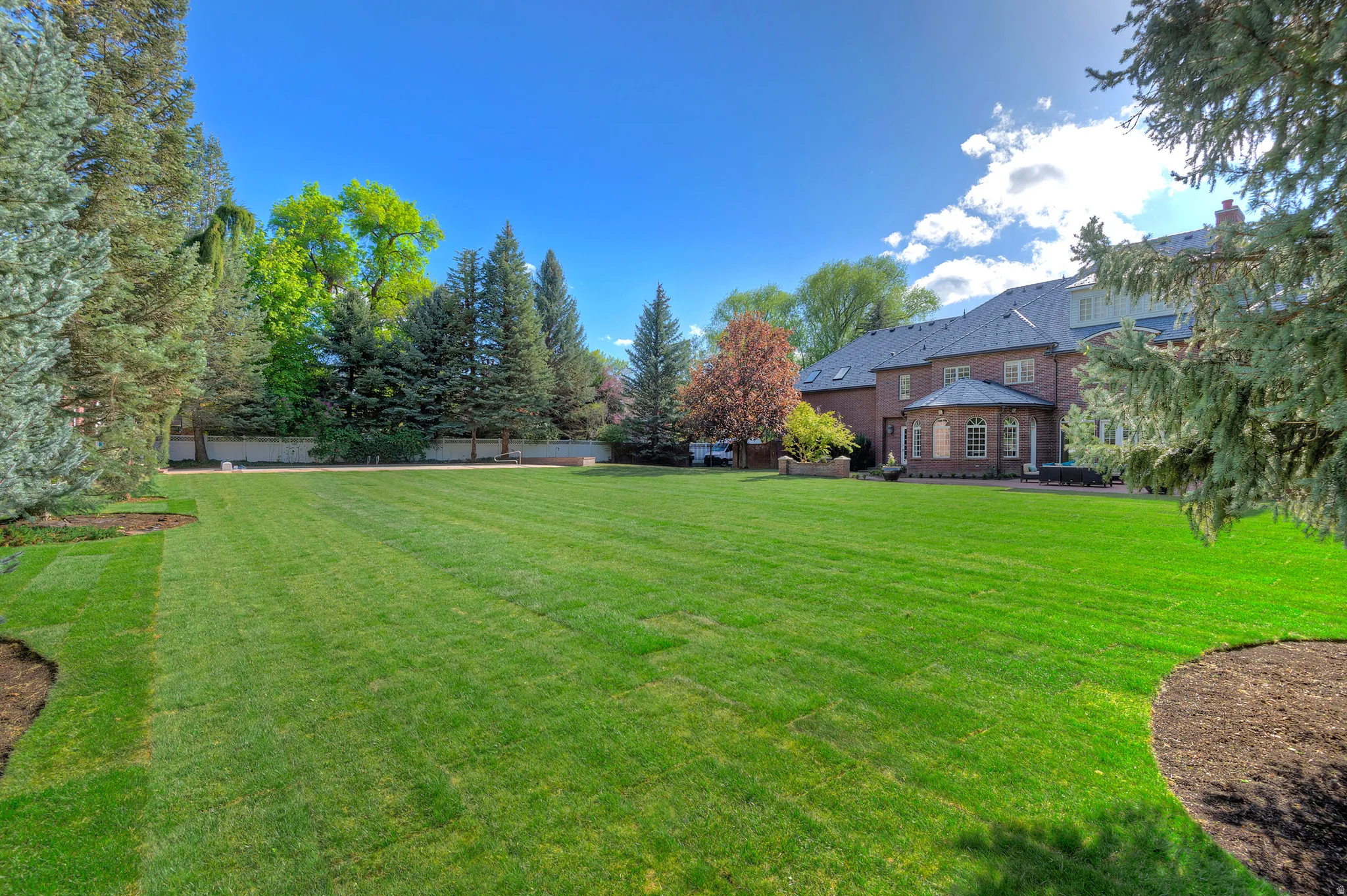 Expansive backyard offers space for any activity or entertainment.