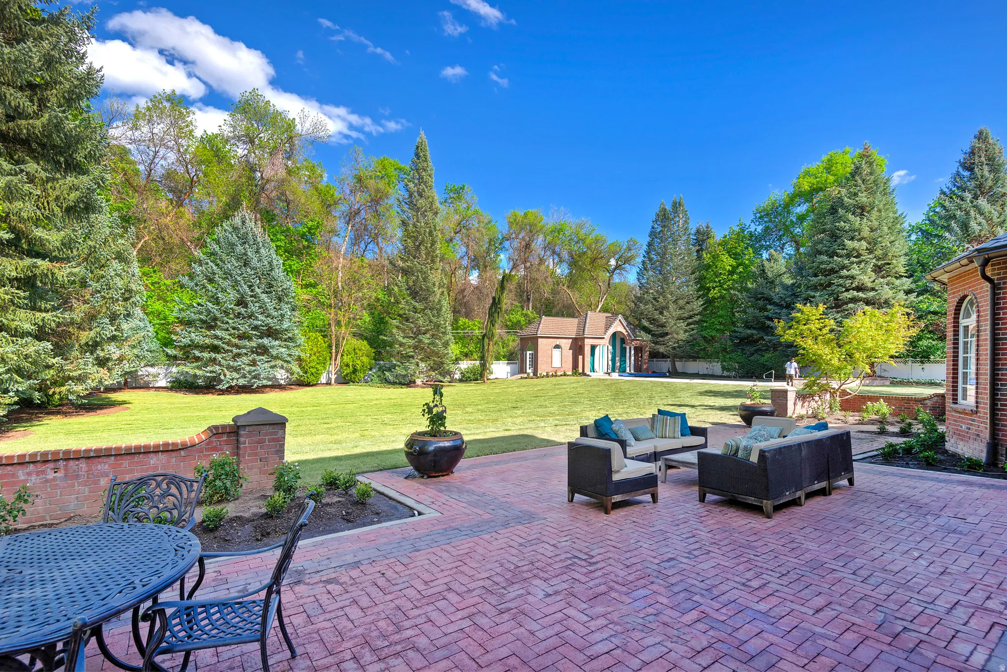 View of patio / terrace with expansive new landscaping.  Private and secluded with full fencing.