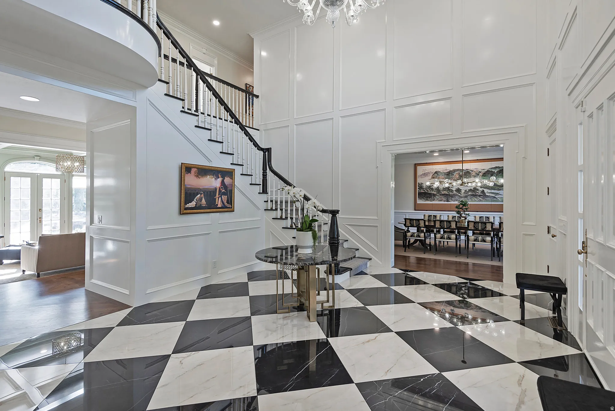 Unique and elegant foyer opens to the stunning formal dining room.
