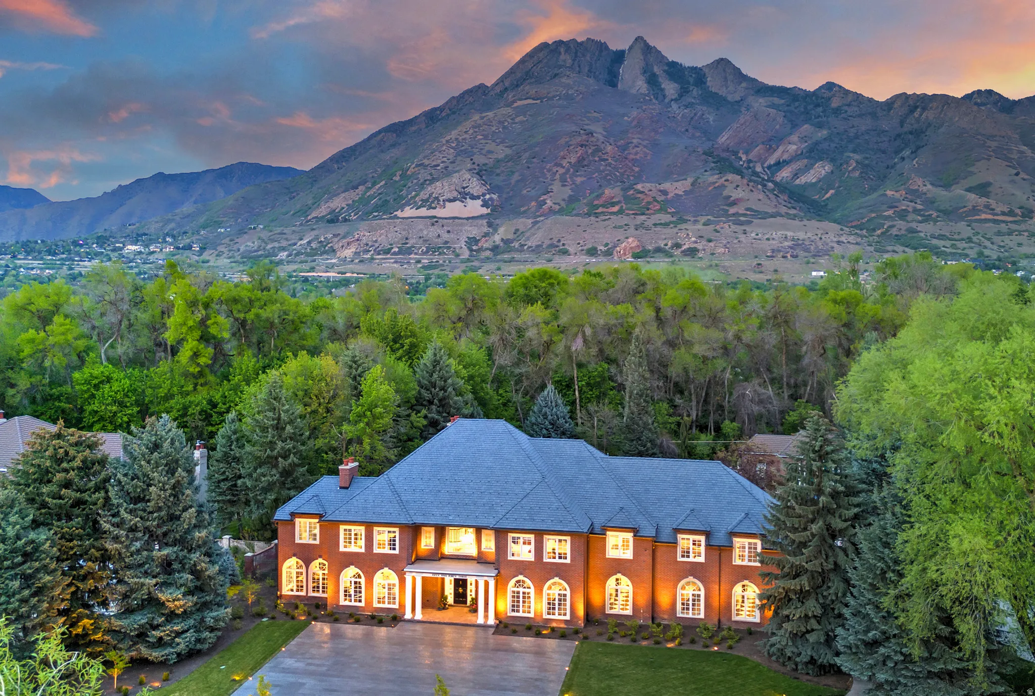 View of mountain background and wooded grounds.