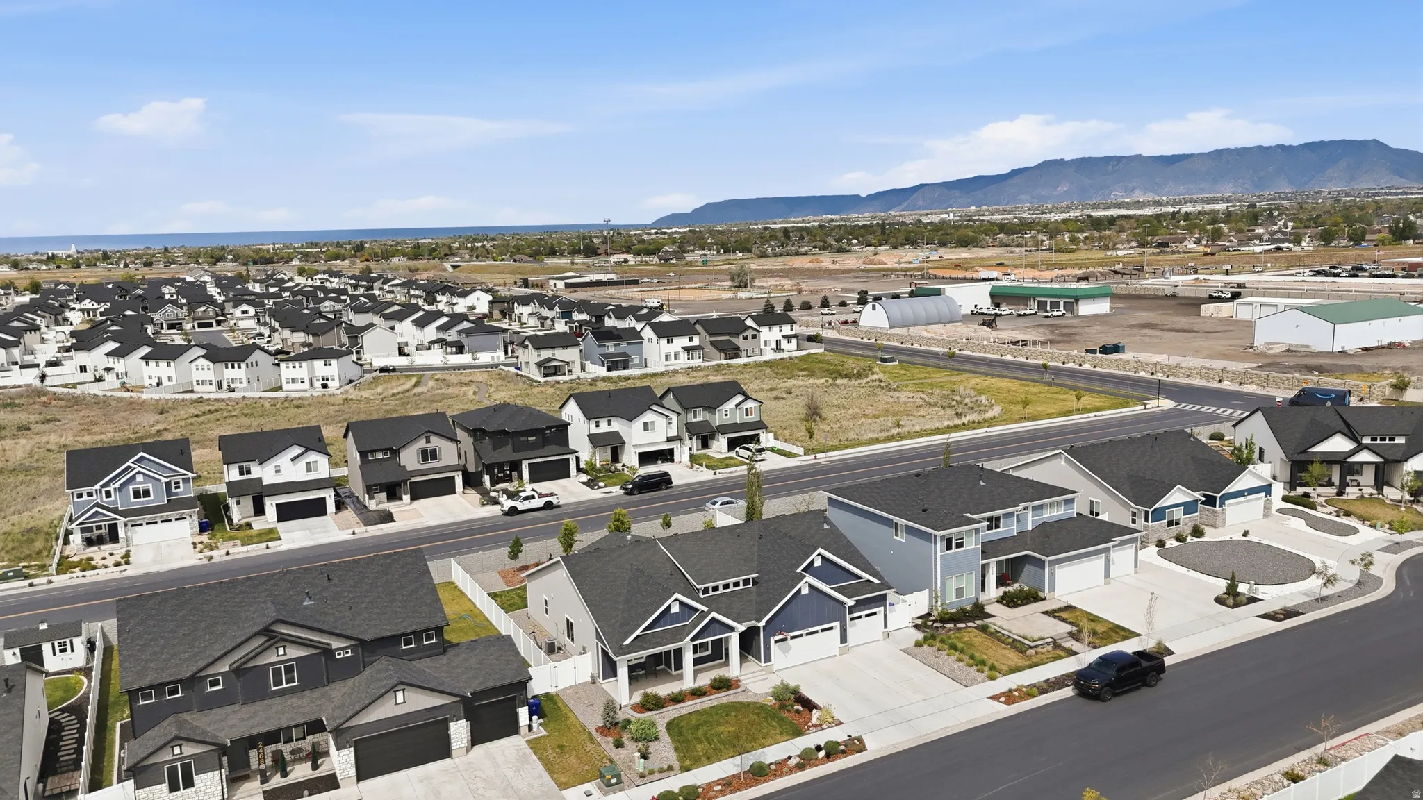 Aerial view of residential area featuring mountains