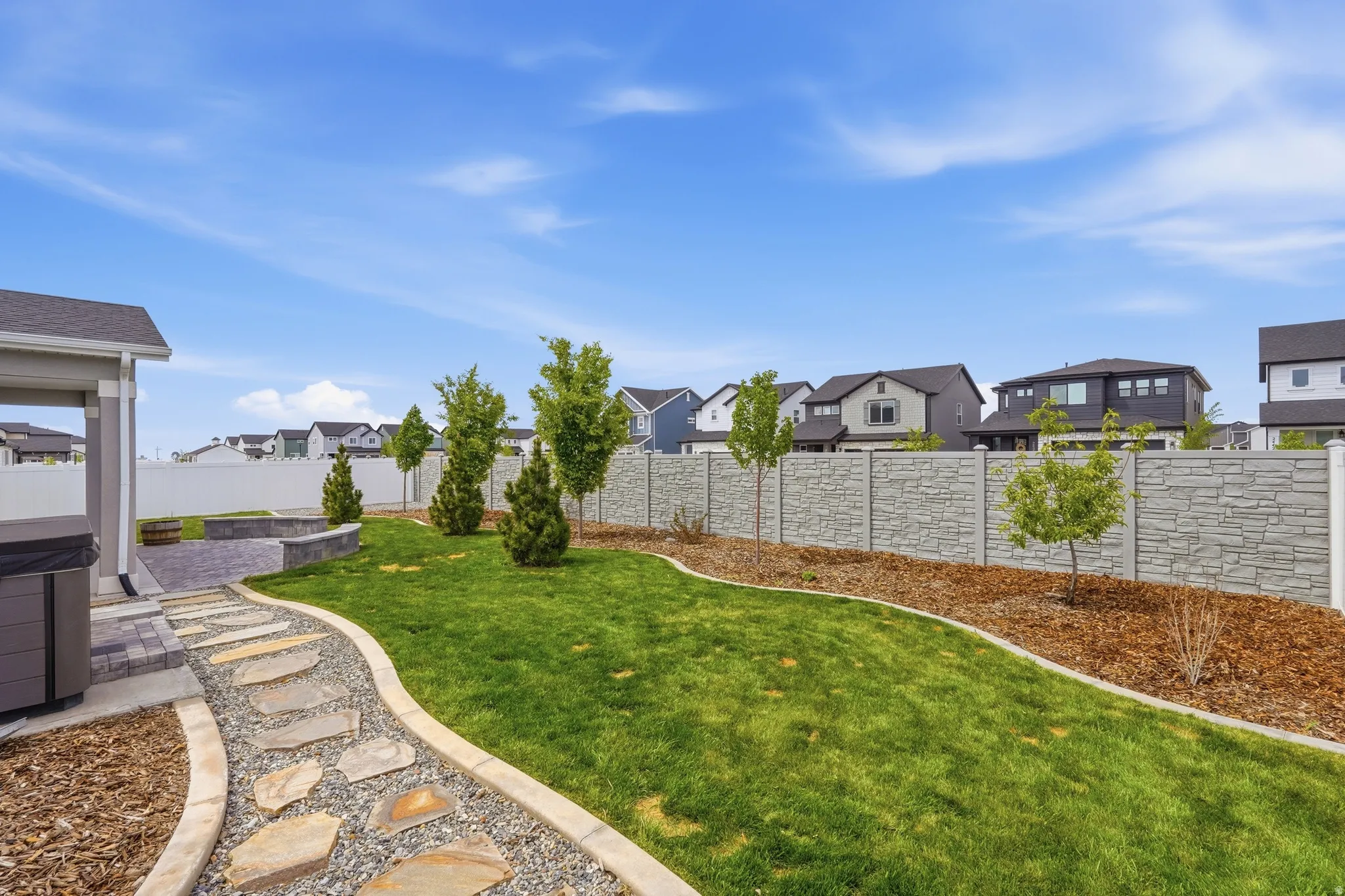 Fenced backyard with a residential view