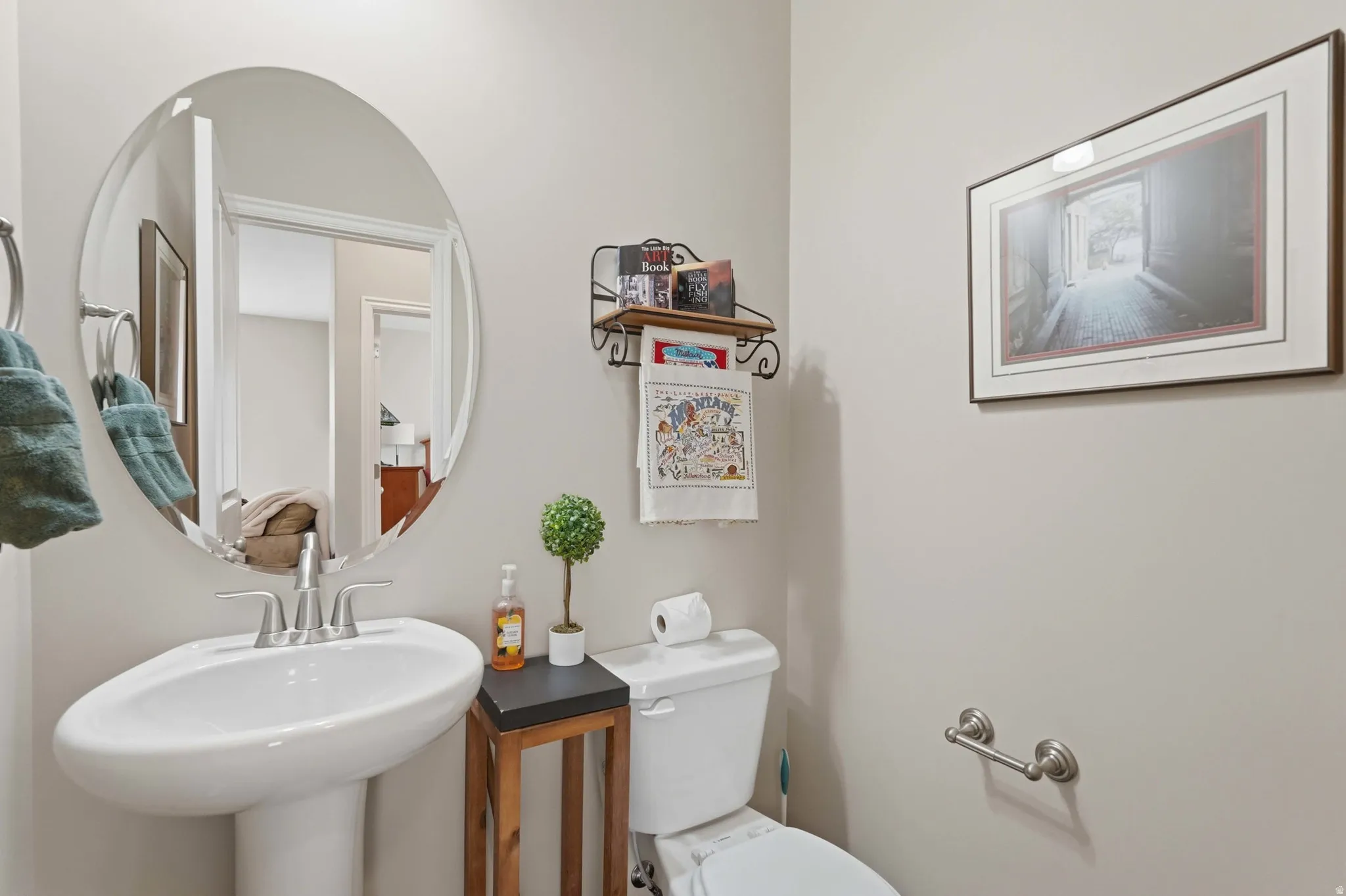 Half bathroom featuring toilet and a sink