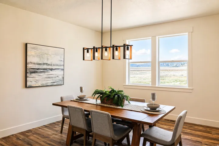 Dining space with baseboards and dark wood-type flooring