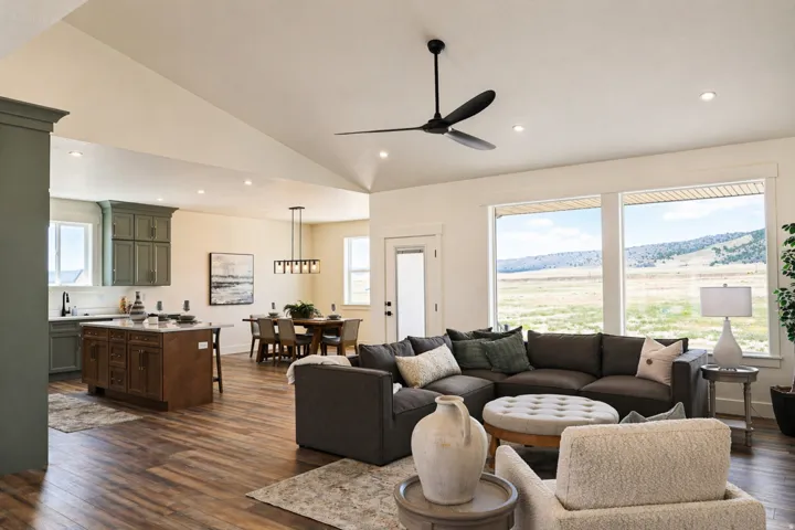 Living area with dark wood-style flooring, lofted ceiling, ceiling fan, a mountain view, and recessed lighting