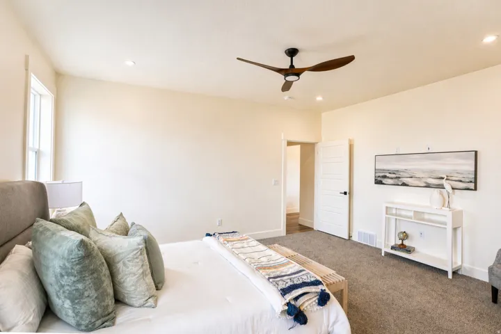 Bedroom with ceiling fan, carpet, and recessed lighting