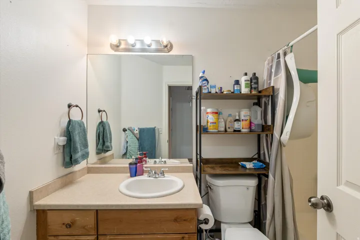 Full bathroom featuring vanity and toilet
