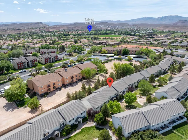 Aerial view of residential area with a mountainous background