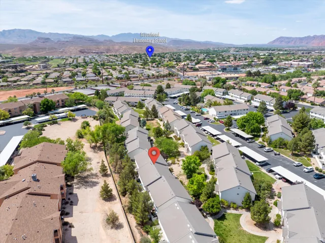 Aerial perspective of suburban area with a mountain backdrop