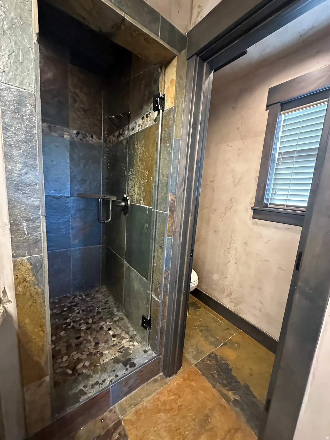 Primary Bathroom featuring heated floors and steam shower