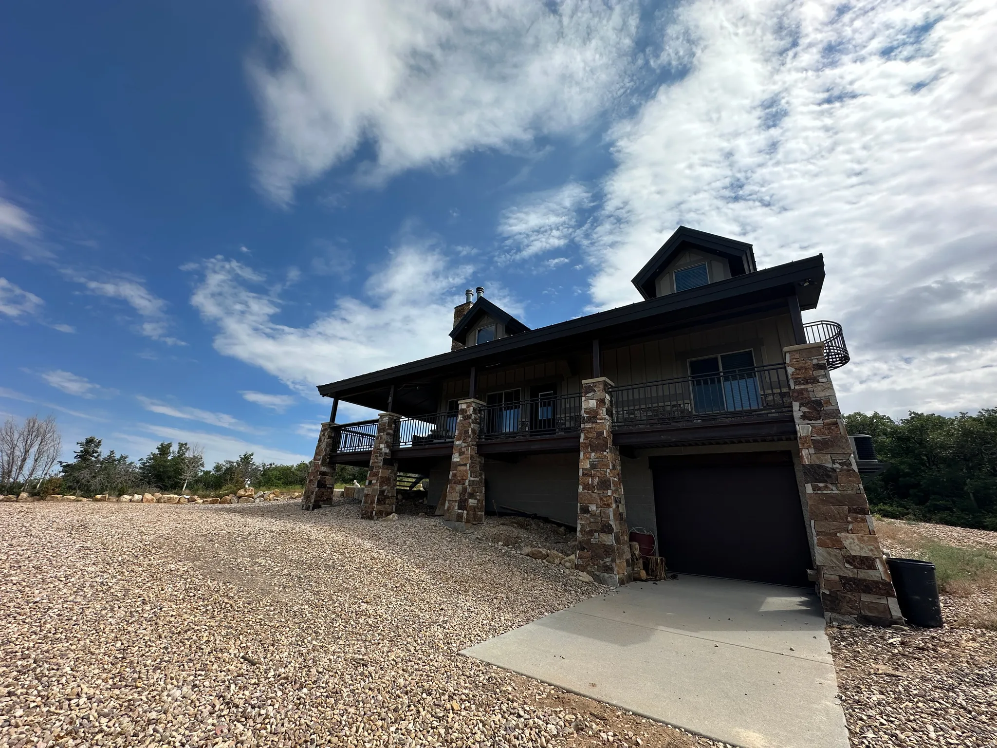 View of front of home with an attached garage and driveway