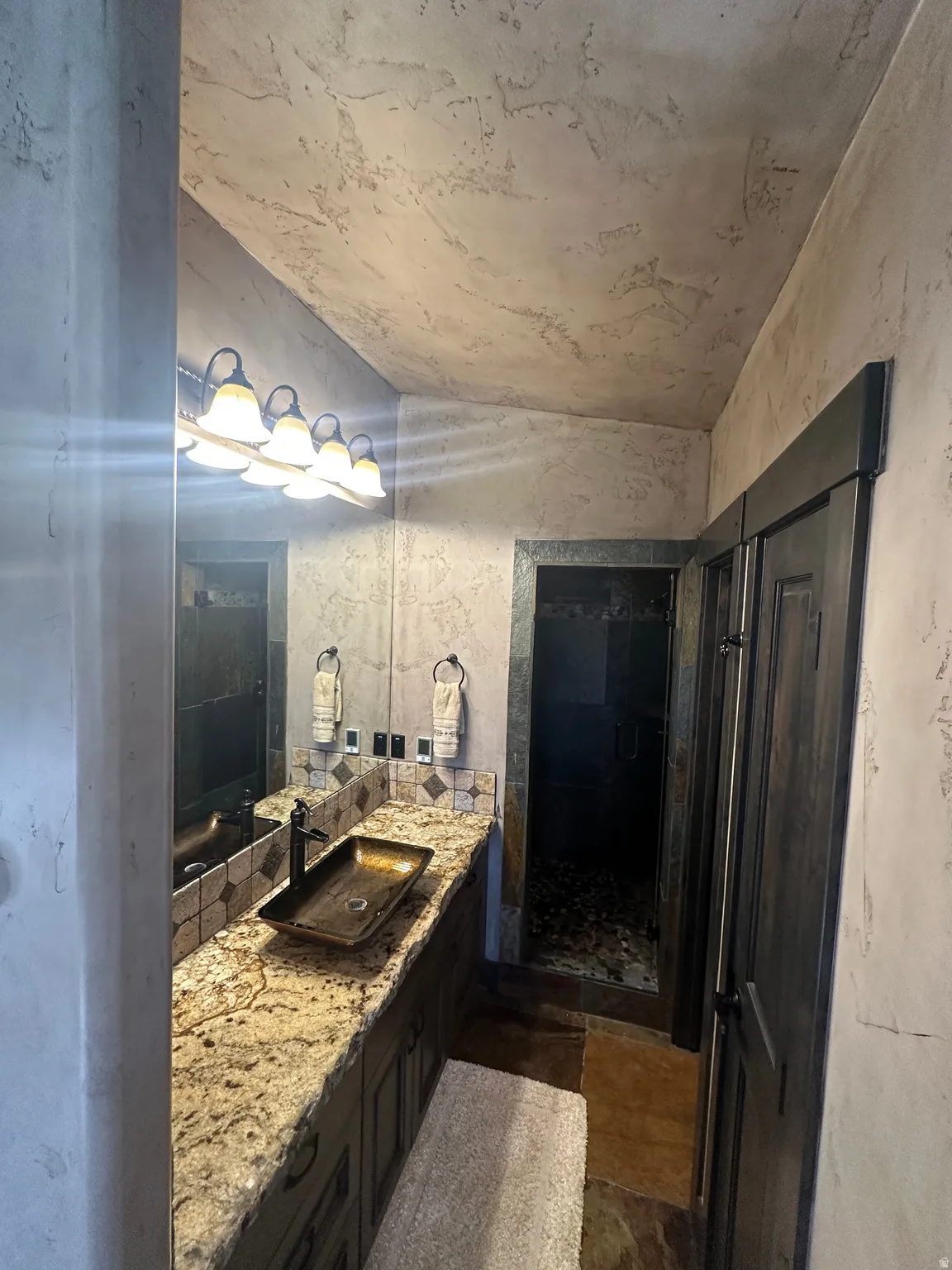 Primary Bathroom featuring heated floors and steam shower