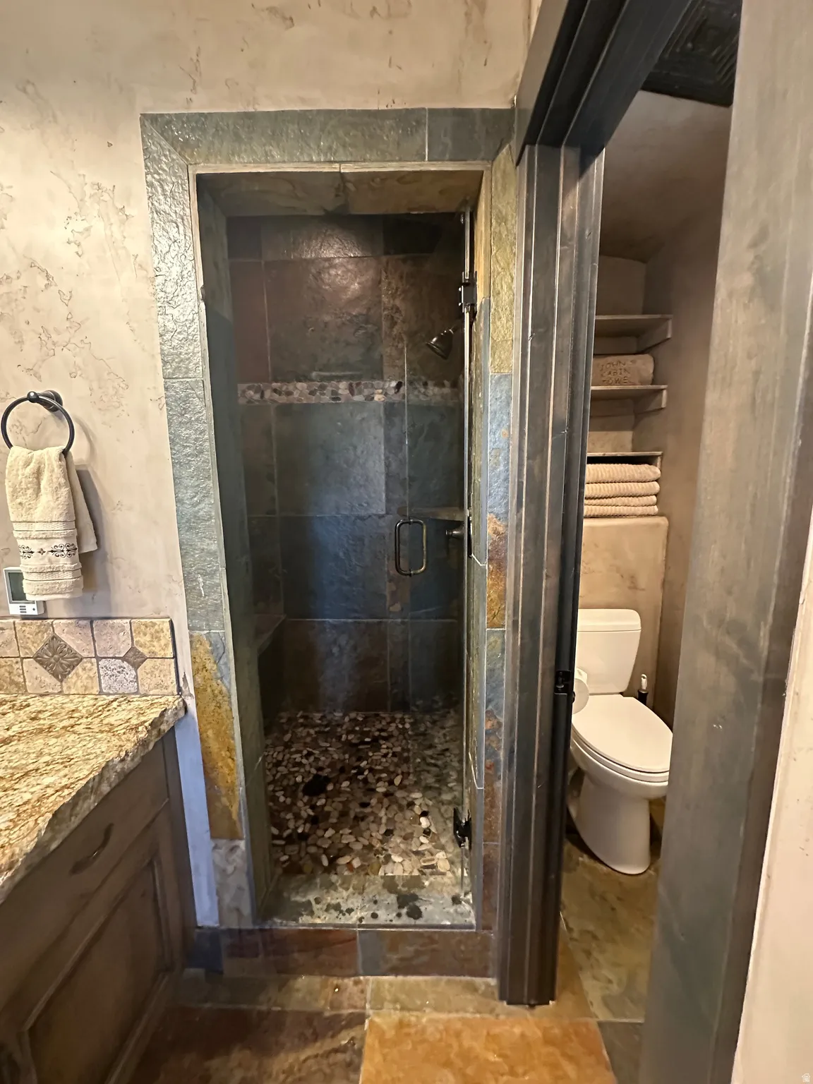 Primary Bathroom featuring heated floors and steam shower