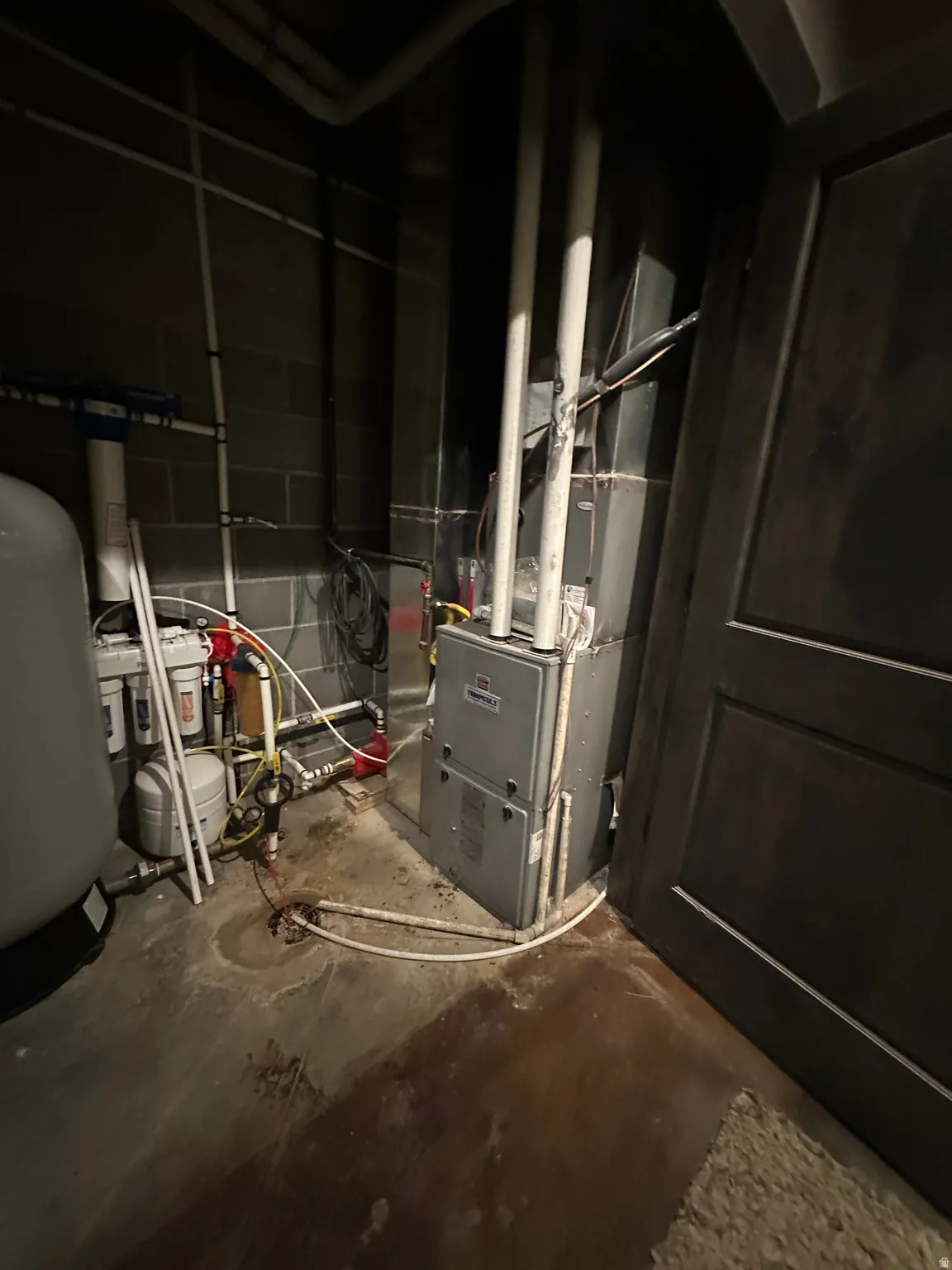 Utility room featuring heating unit