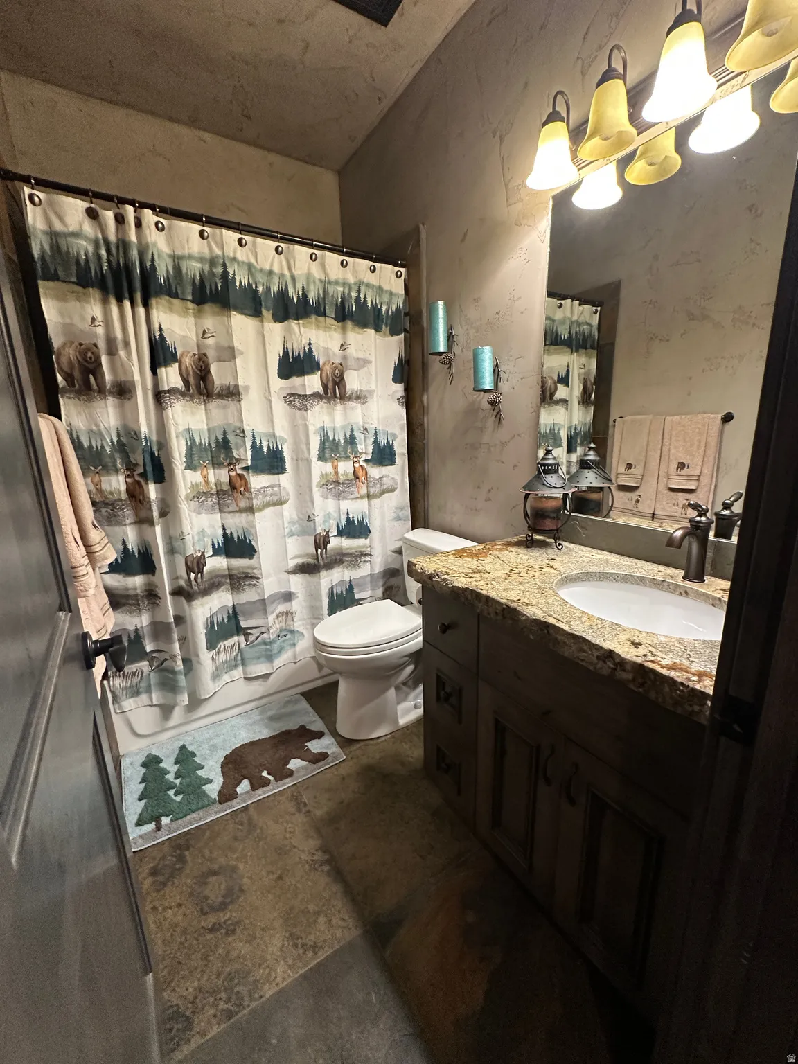 Full bath with vanity and shower / bathtub combination with heated floors