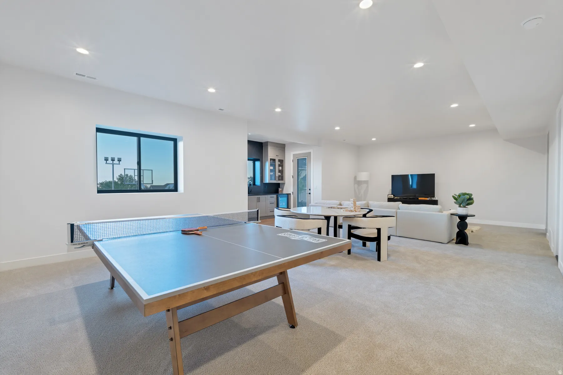 Game room featuring light carpet and recessed lighting