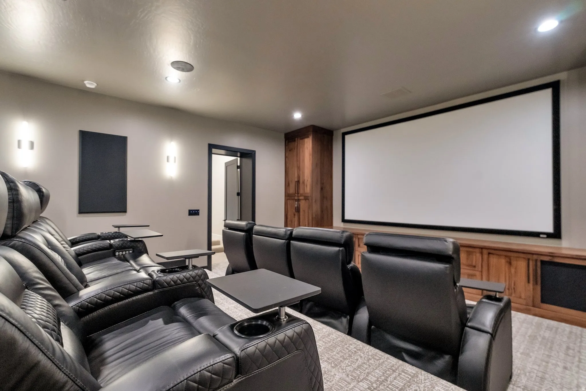 Cinema featuring recessed lighting and light carpet
