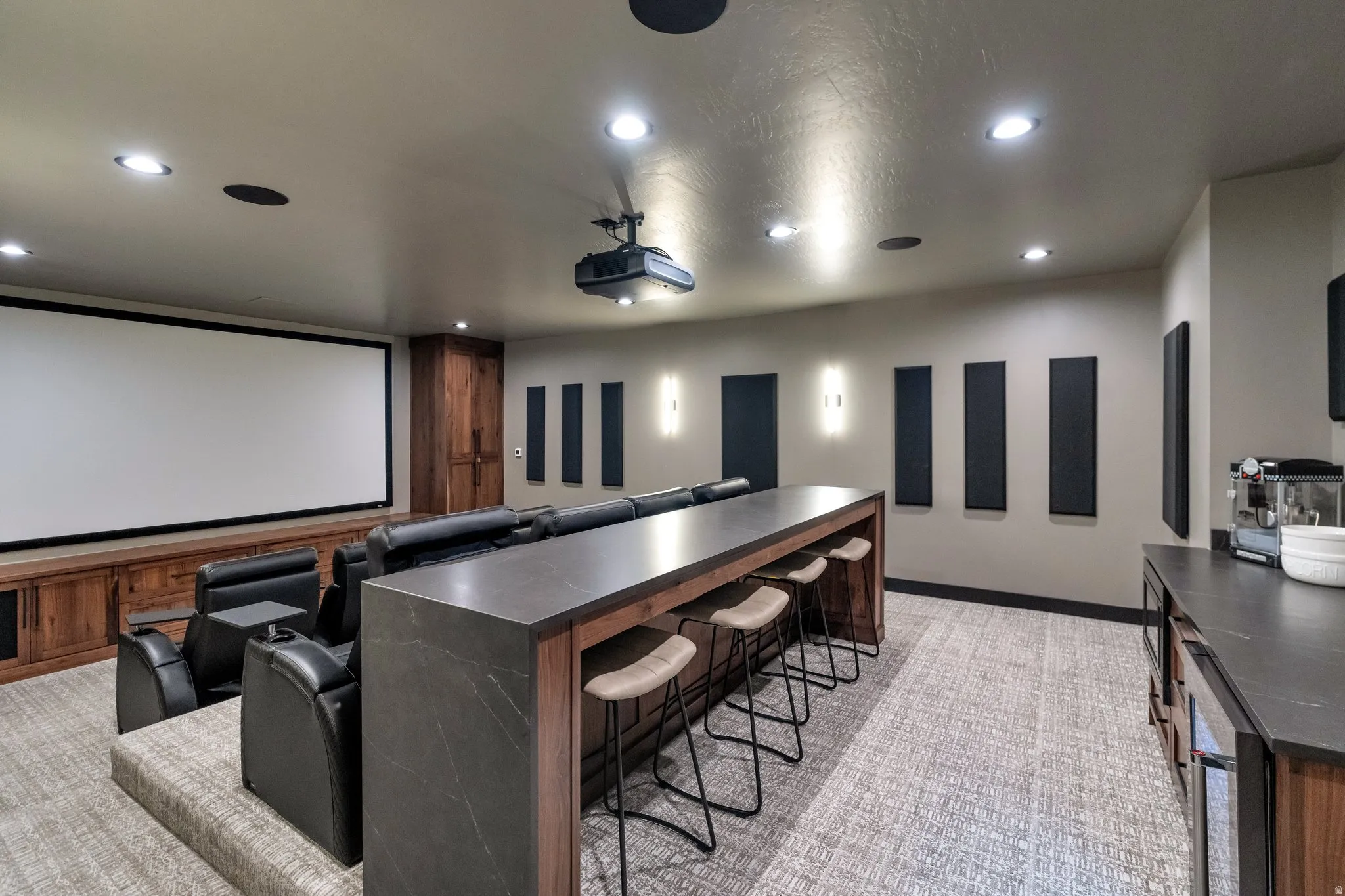 Home theater with recessed lighting, light colored carpet, and wine cooler
