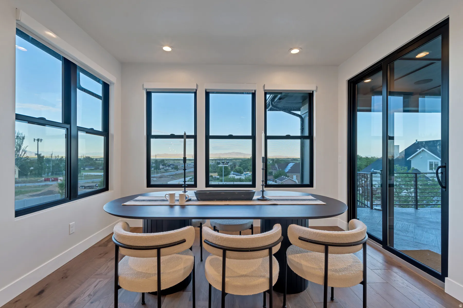 Dining space with light wood-style flooring and recessed lighting