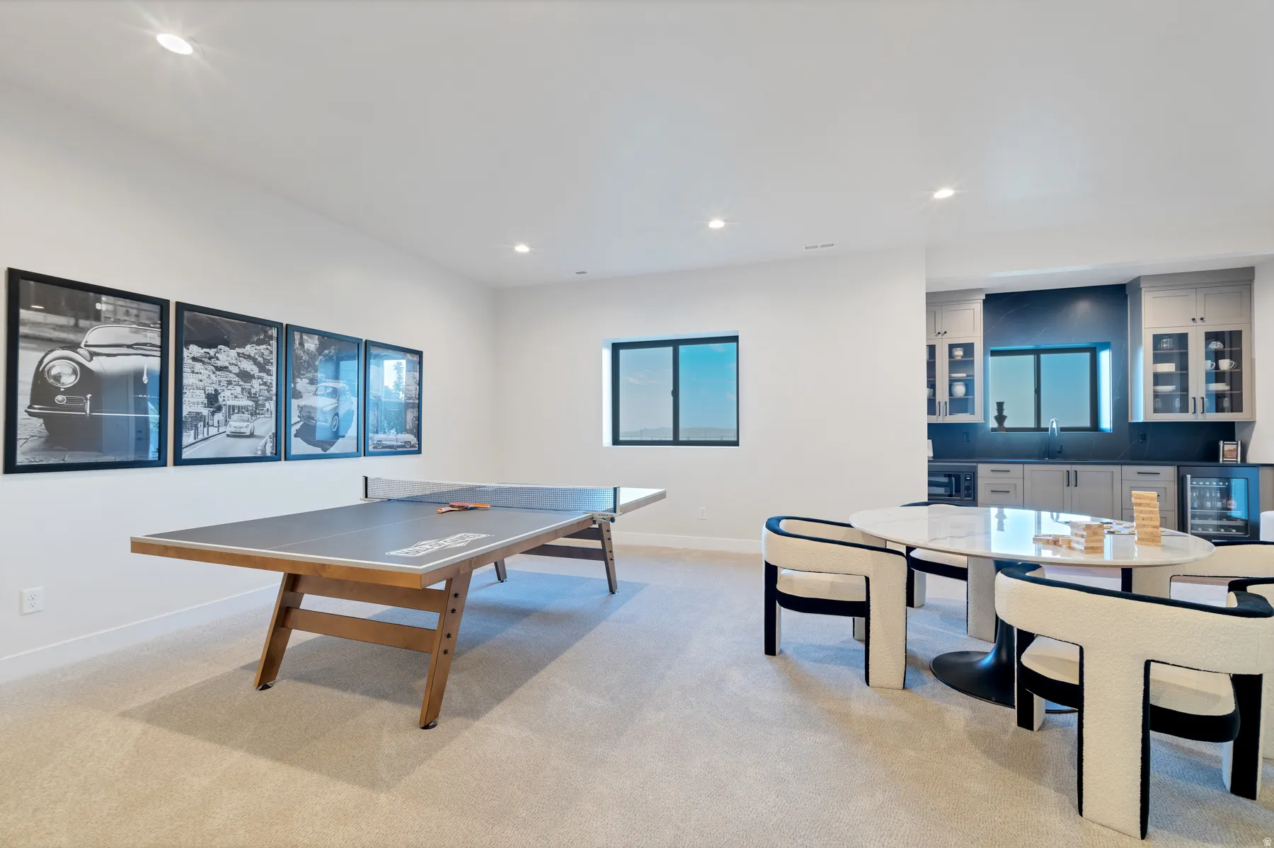 Playroom with light colored carpet, recessed lighting, wet bar, and wine cooler
