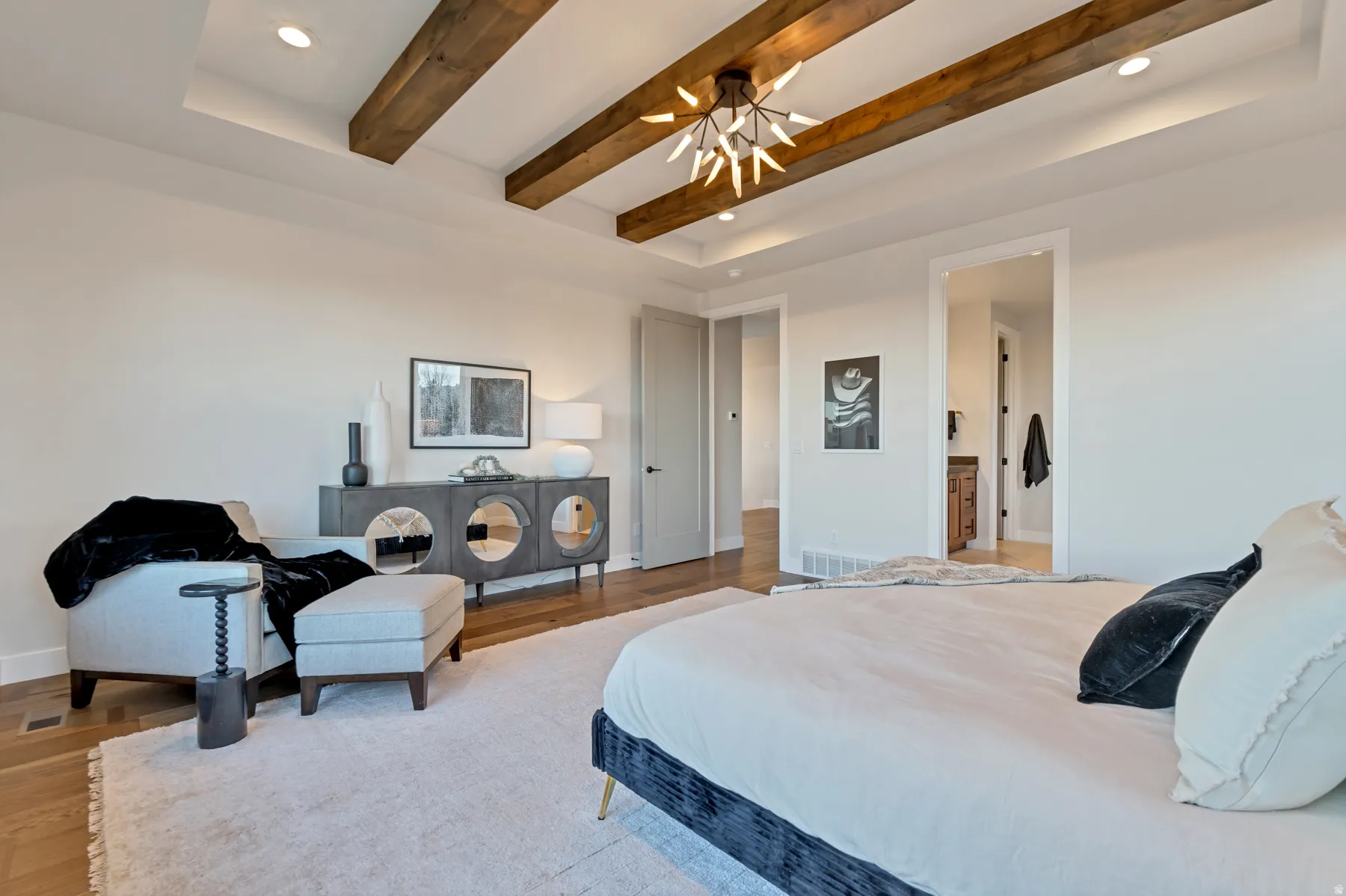 Bedroom with recessed lighting, beamed ceiling, light wood-style floors, and ceiling fan