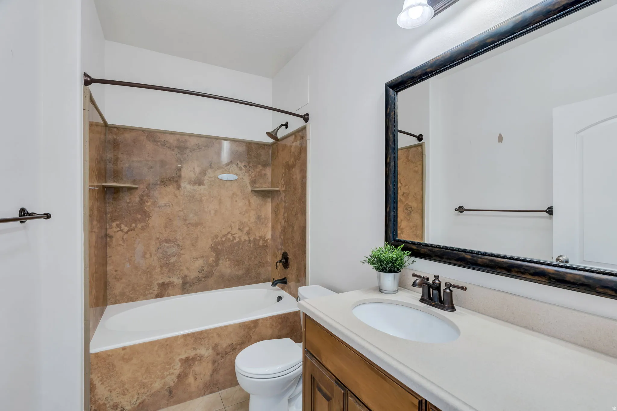 Bathroom with vanity and shower / washtub combination