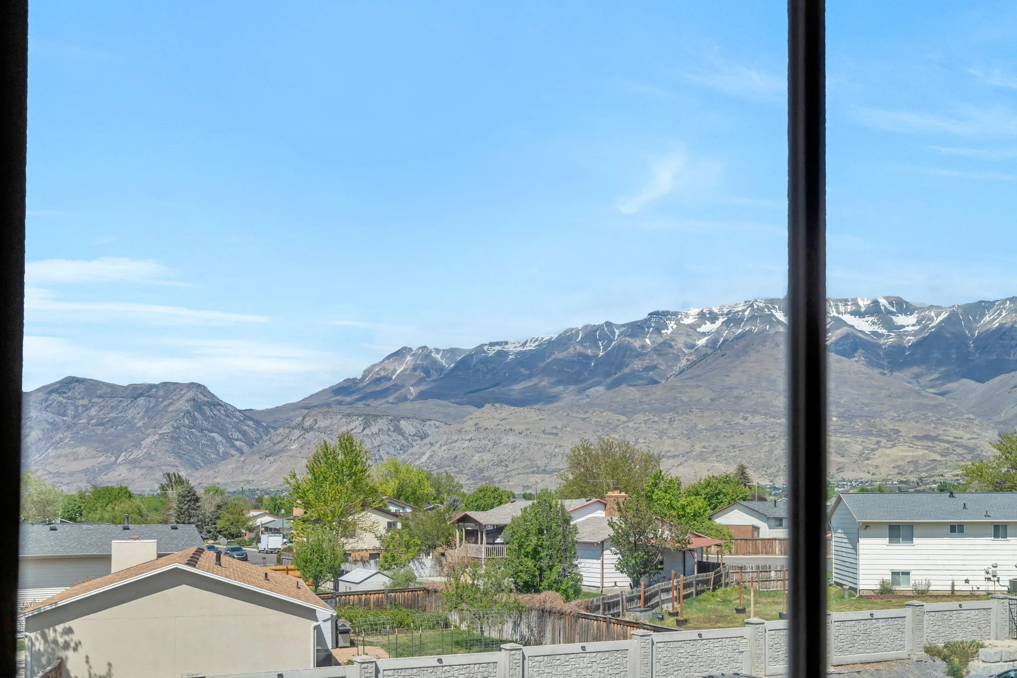 View of mountain background featuring nearby suburban area