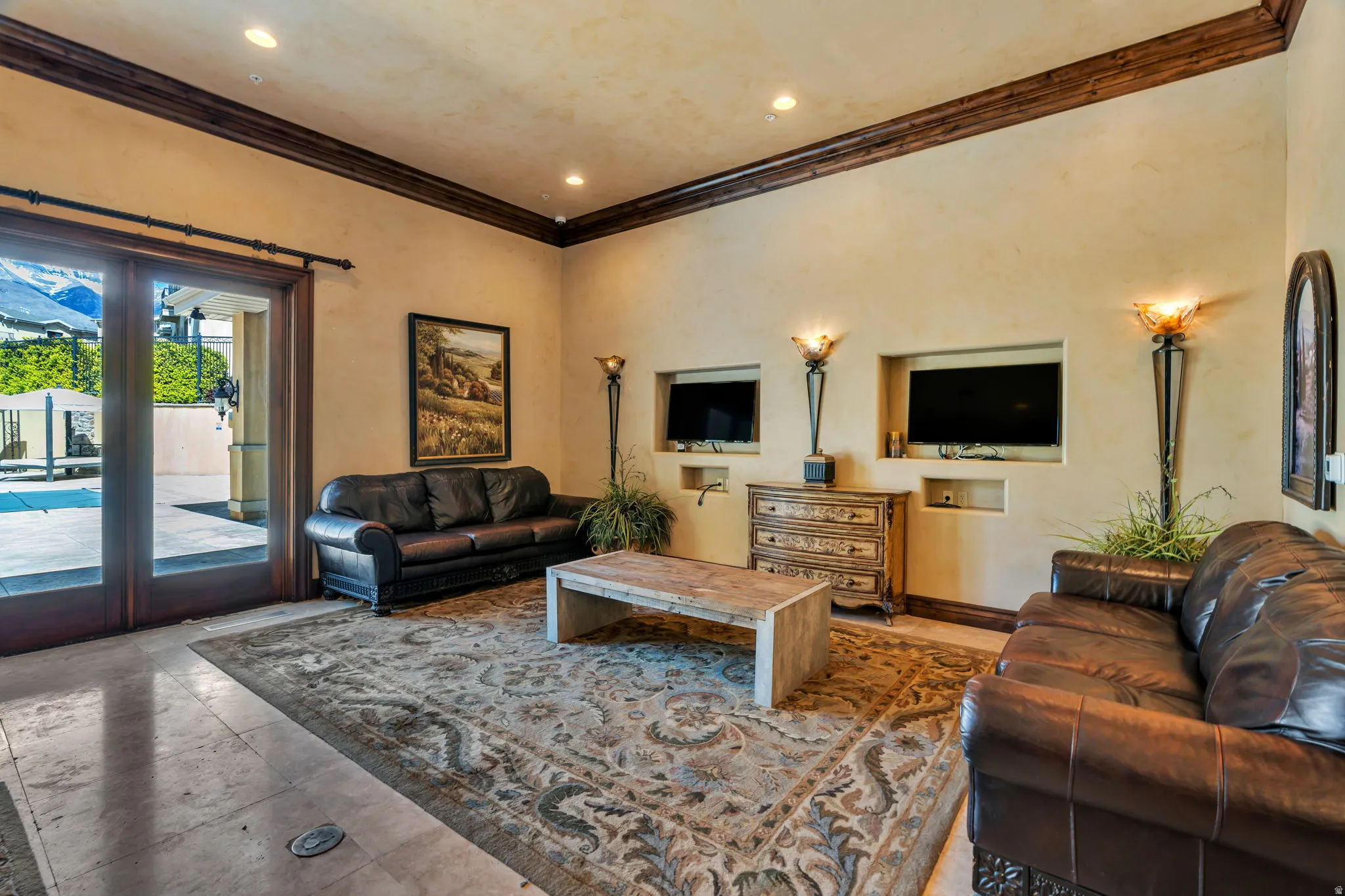 Living room featuring ornamental molding and recessed lighting