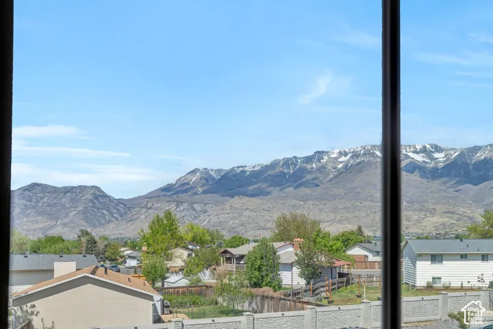 View of mountain background featuring nearby suburban area