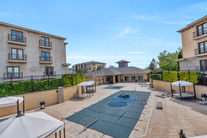 Community pool featuring a patio