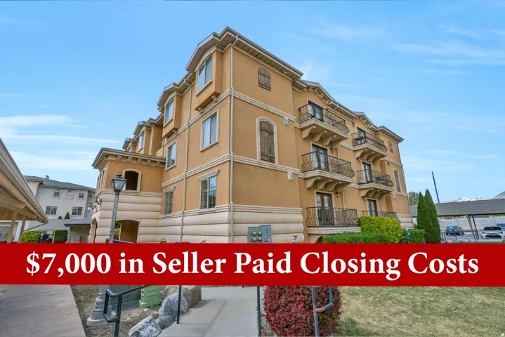 Multi-story stucco exterior featuring multiple balconies with wrought iron railings, arched window details, and decorative window shutters Seller offering 7,000 dollars in seller paid closing gosts