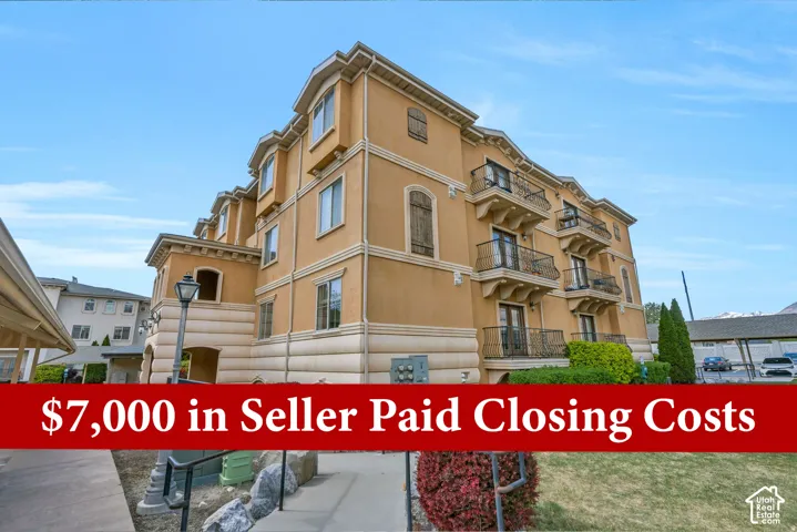 Multi-story stucco exterior featuring multiple balconies with wrought iron railings, arched window details, and decorative window shutters Seller offering 7,000 dollars in seller paid closing gosts