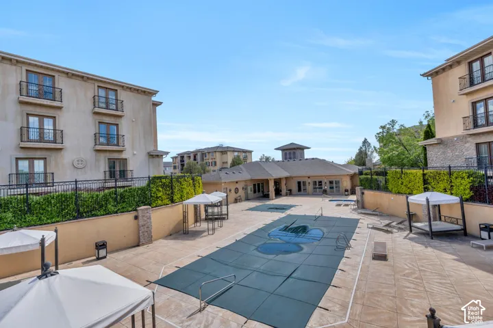 Community pool featuring a patio