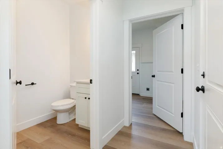 Bathroom with light wood-type flooring and vanity