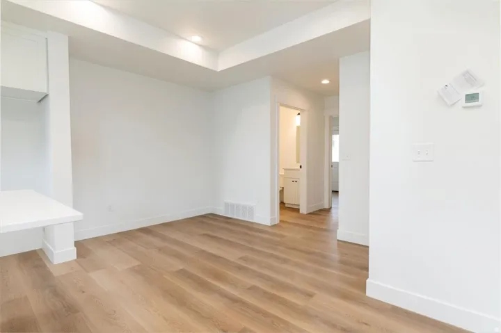 Unfurnished dining area with recessed lighting and light wood-style floors