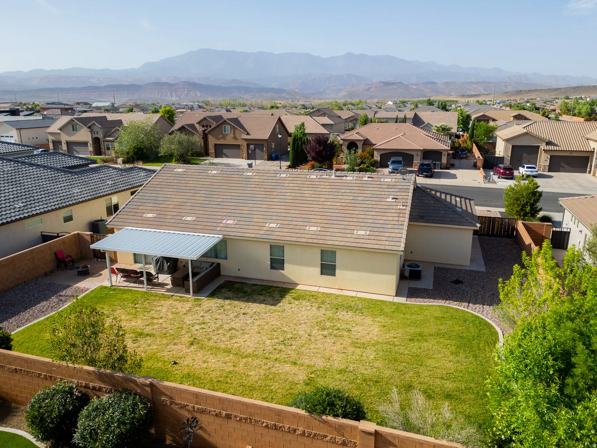 Aerial view of residential area featuring a mountainous background