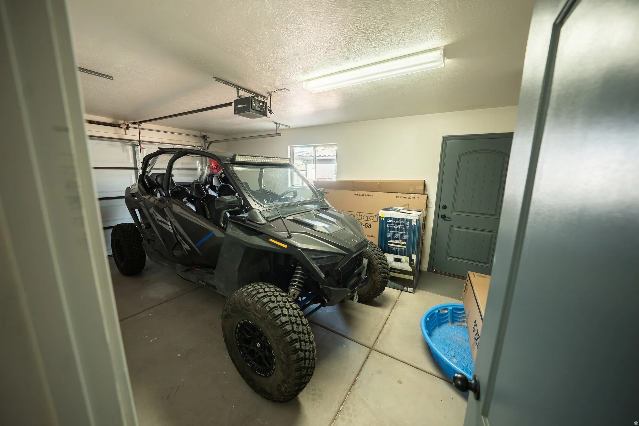 Garage featuring a garage door opener