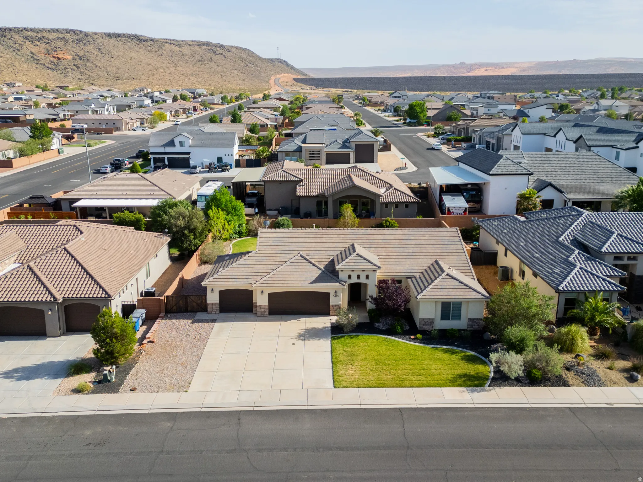Aerial perspective of suburban area with a mountainous background
