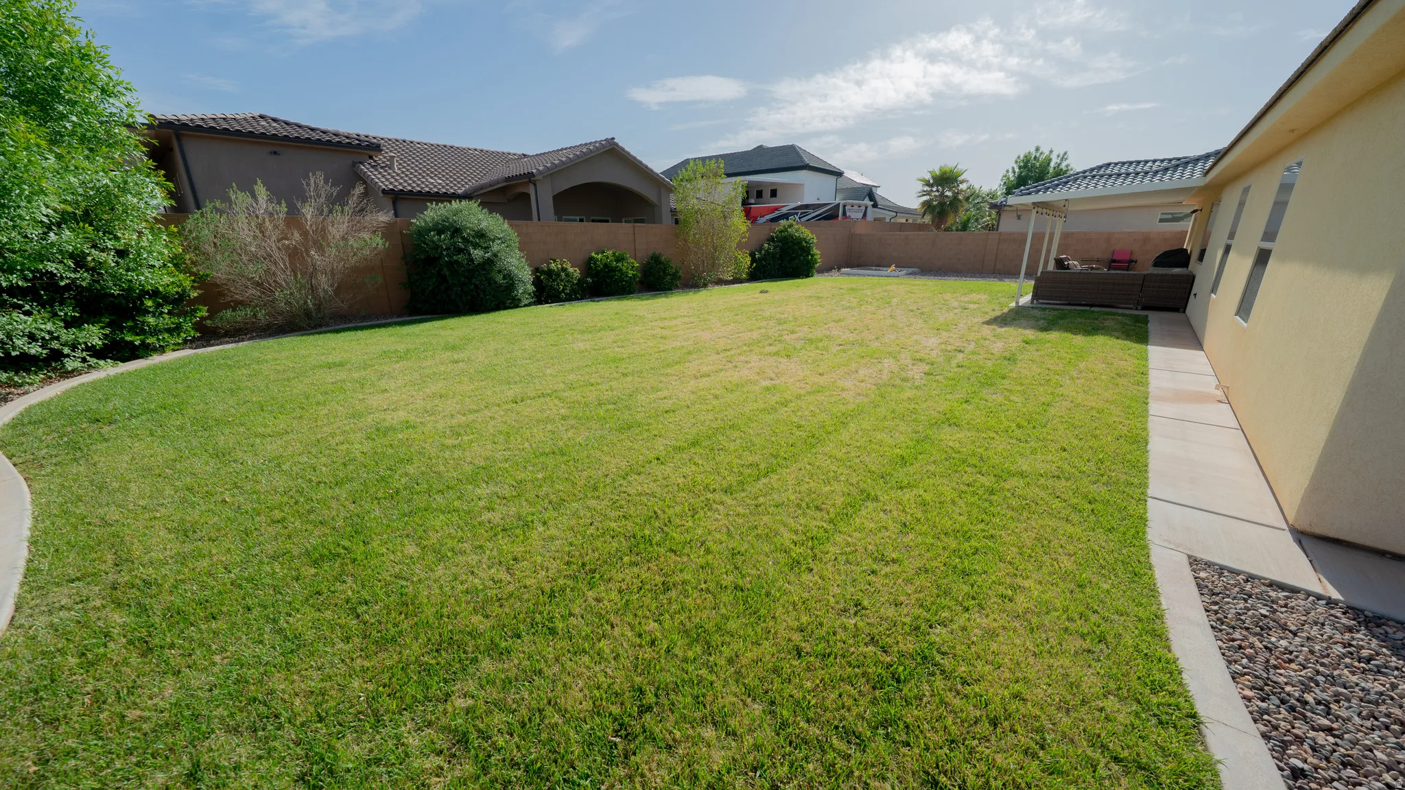 View of fenced backyard